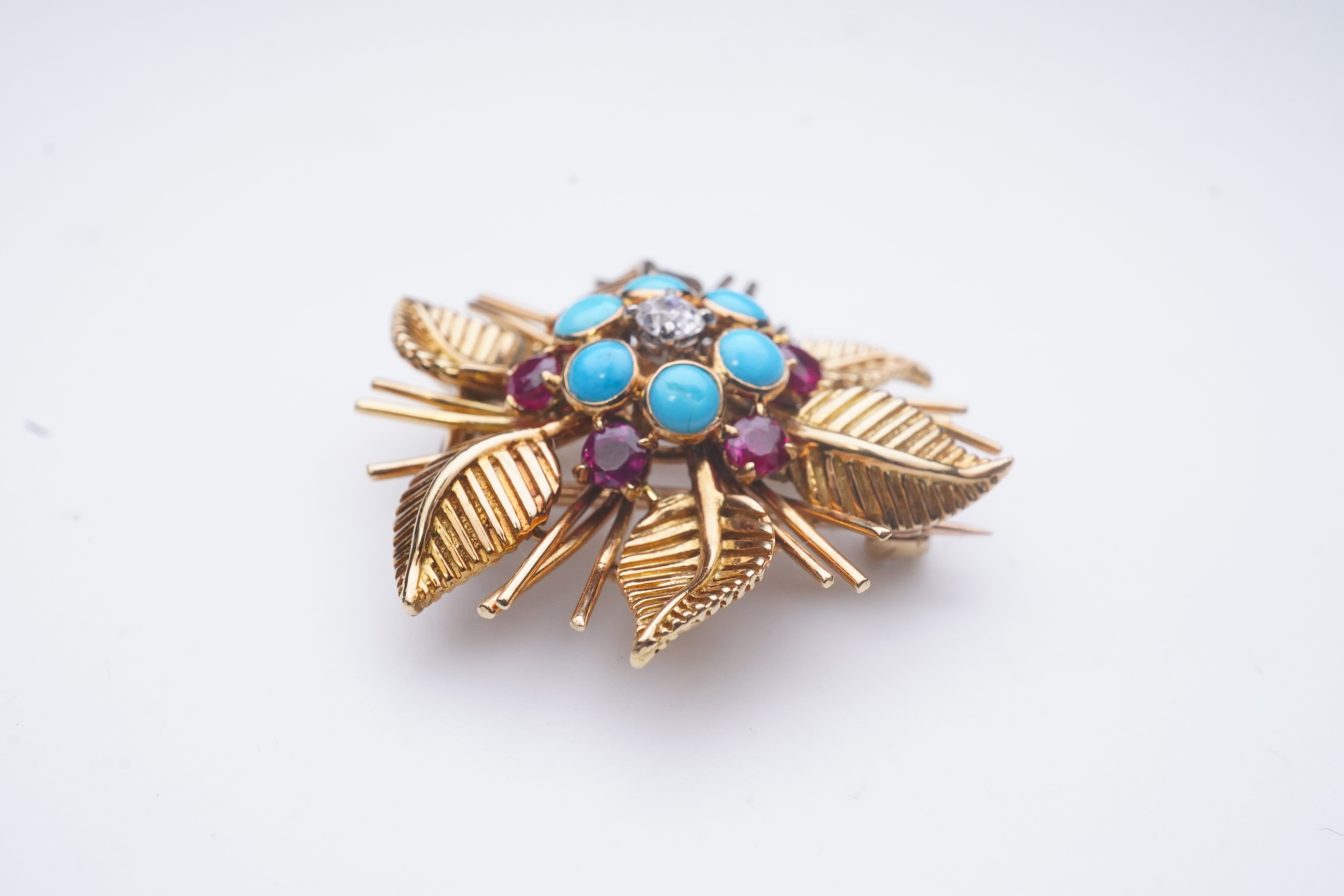 Chaumet, a turquoise, ruby and diamond brooch, mid 20th century